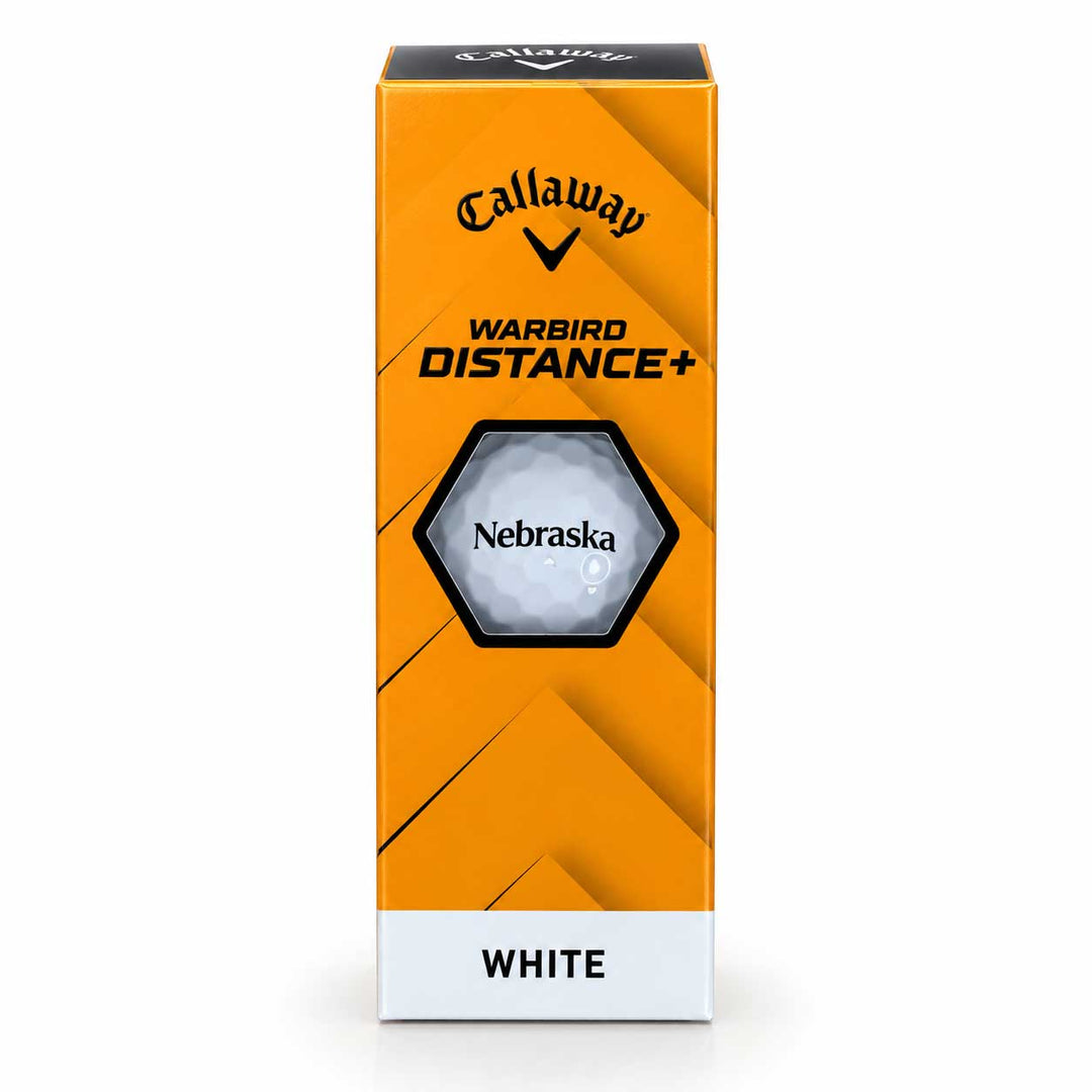 Callaway Warbird Distance+ golf ball in its retail packaging, featuring a white golf ball printed with 'Nebraska' inside a hexagonal cutout on an orange and black box, with 'WHITE' printed on a white band at the bottom.