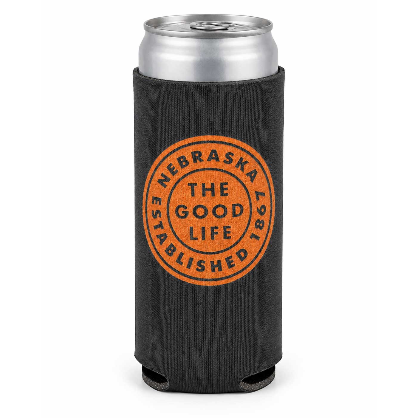 A black neoprene can cooler sleeve with a silver aluminum can inserted, featuring an orange circular stamp design that reads 'NEBRASKA 2025 THE GOOD LIFE ESTABLISHED'.