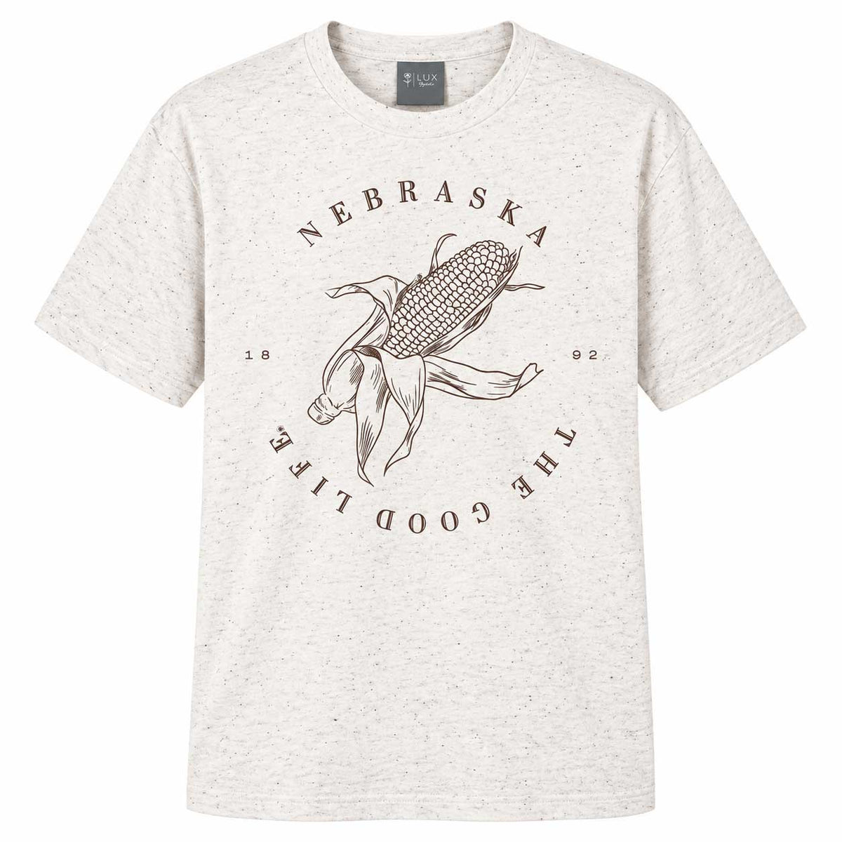 A light heather gray crewneck t-shirt featuring a brown graphic of a corn cob and silhouettes of a cowboy hat and a steer, with the text 'NEBRASKA', 'THE GOOD LIFE', and '1892' printed around it.
