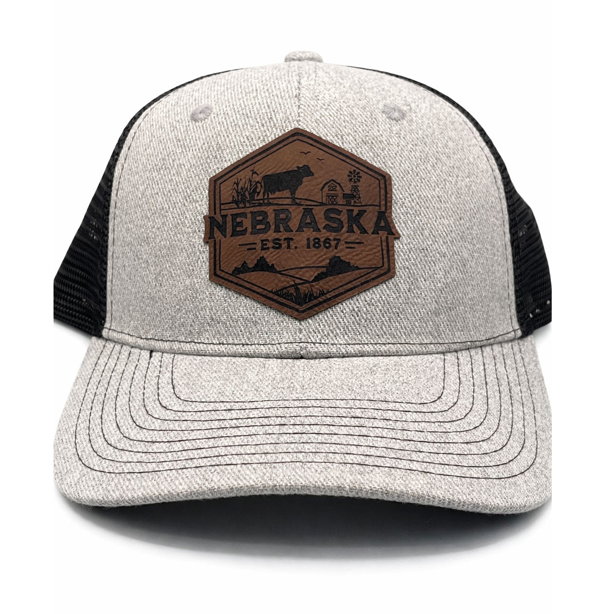Gray and black cap with a brown 'Nebraska' logo on a white background