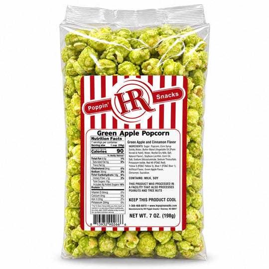 A 7 oz bag of green apple popcorn with a red and white striped label, photographed on a clean white background.