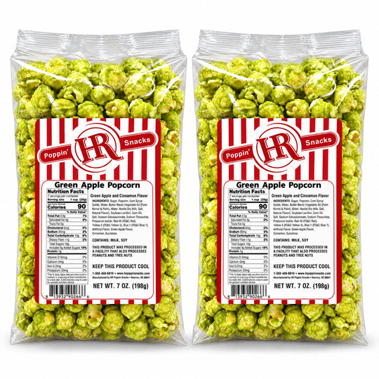 Two clear plastic bags of Poppin' HR Snacks Green Apple Popcorn, filled with bright green popcorn and featuring a red and white striped label with product details.