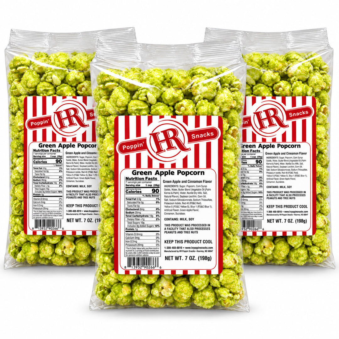 Three clear plastic bags of Poppin' IR Green Apple Popcorn Scented Flavors, arranged in a fan shape against a solid white background.