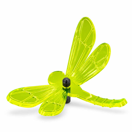 A translucent neon yellow-green dragonfly-shaped wind spinner with a black central hub and support post, shown on a clean white background.