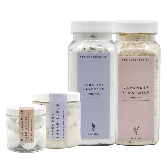 Collection of lavender-themed bath products from Our Lavender Co. on a white background.
