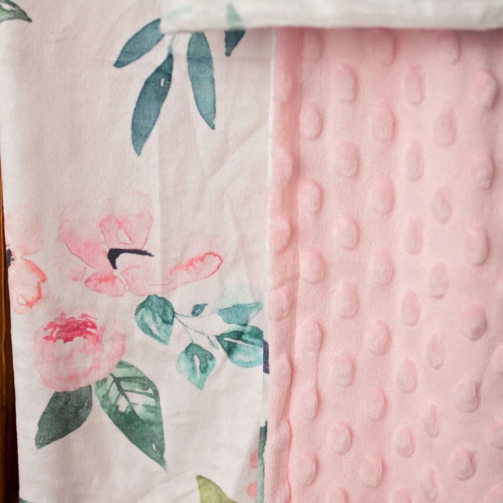 Two fabric swatches side by side; one with floral pattern and the other with pink textured surface.