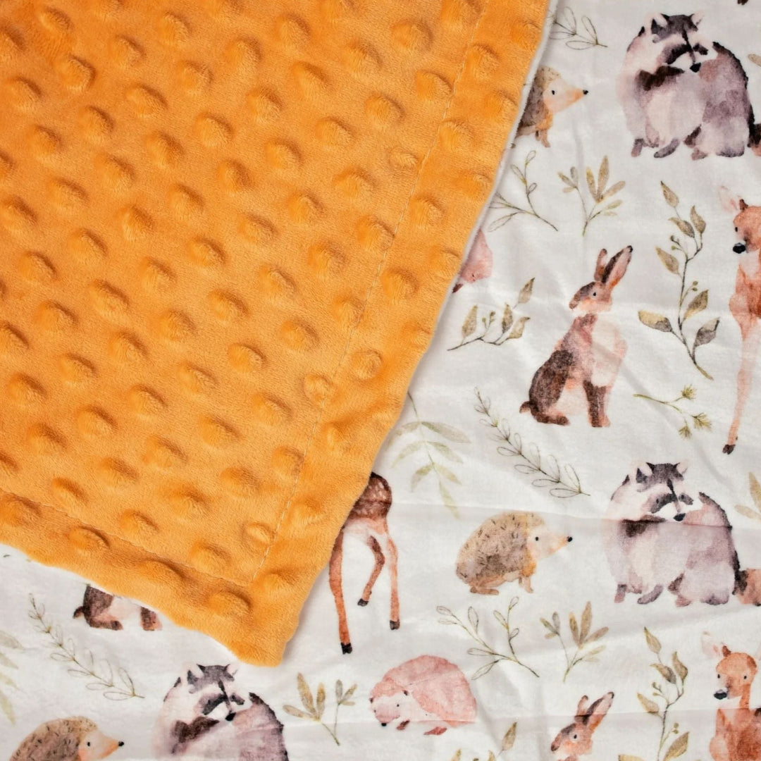 Baby blanket with animal pattern and textured orange side