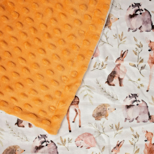 Baby blanket with animal pattern and textured orange side