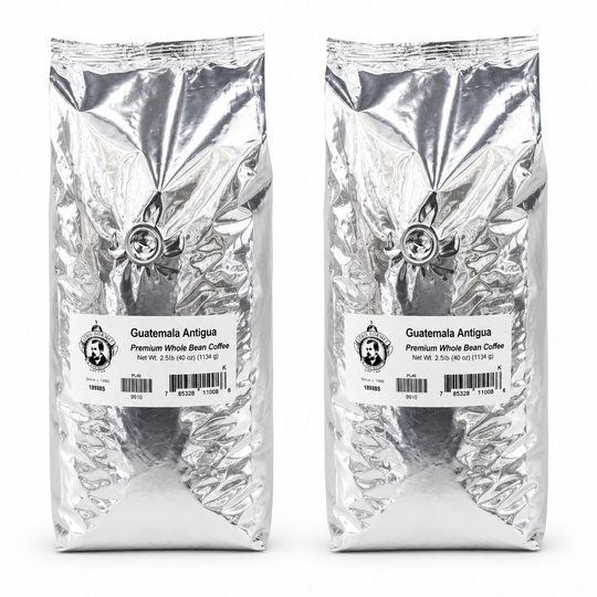 Two packages of Guatemala Antigua coffee on a white background