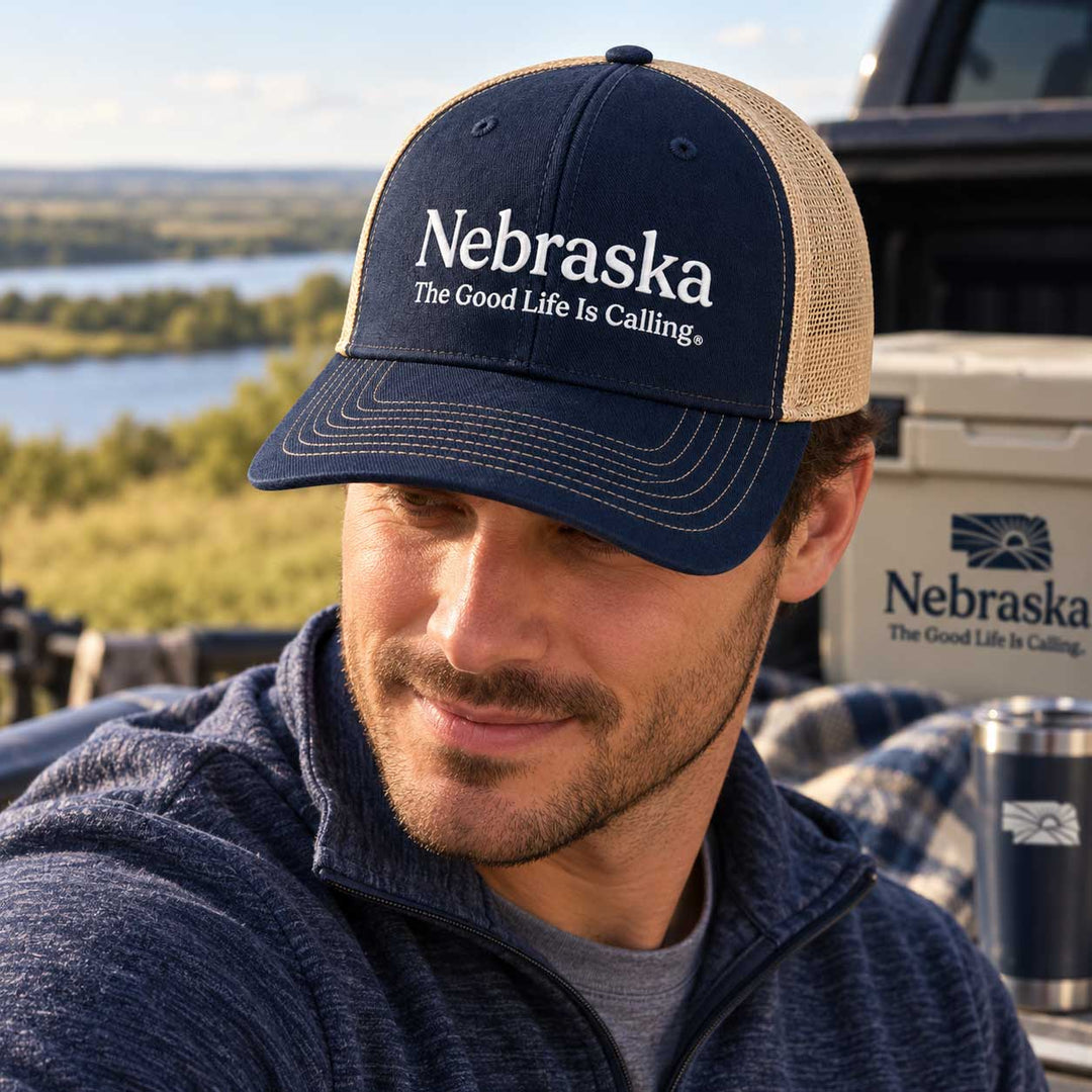 Man with Nebraska hat on.