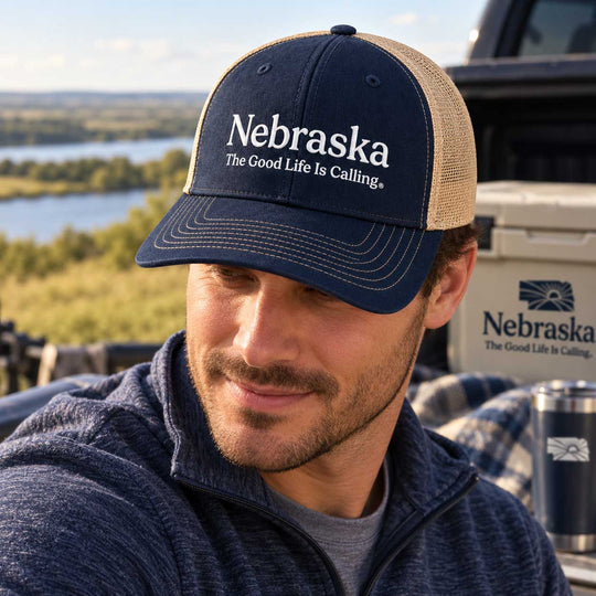 Man with Nebraska hat on.
