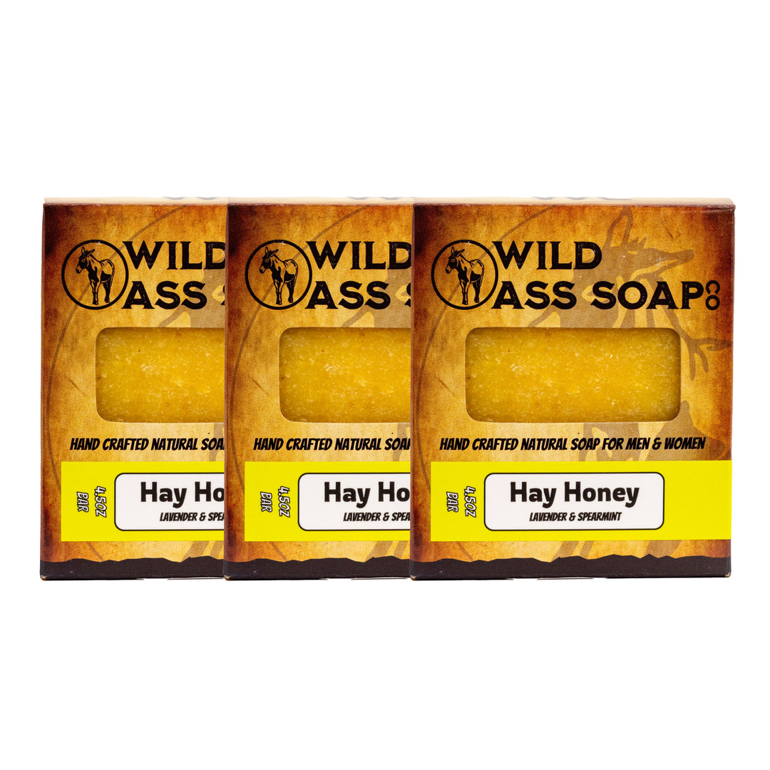 Three bars of Wild Ass Soap with 'Hay Honey' label on a white background