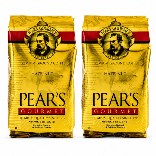 Two packages of Pear's Gourmet Hazelnut coffee on a white background