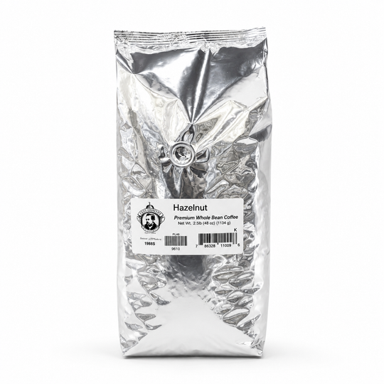 Silver coffee bag labeled 'Hazelnut' on a white background
