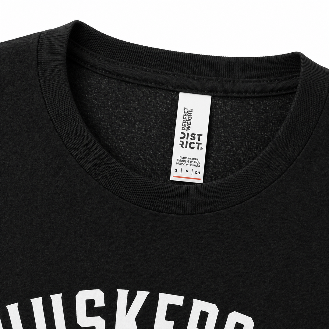 Black t-shirt with a visible label on the collar