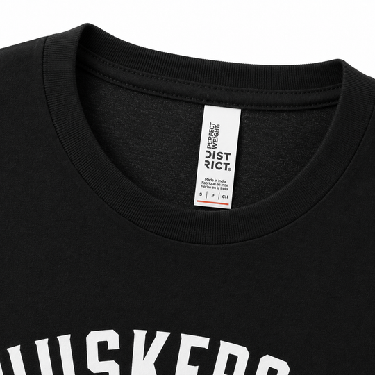 Black t-shirt with a visible label on the collar