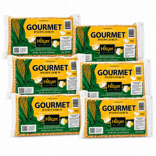 Six packages of Hilger Gourmet Popcorn arranged in two rows on a plain white background.
