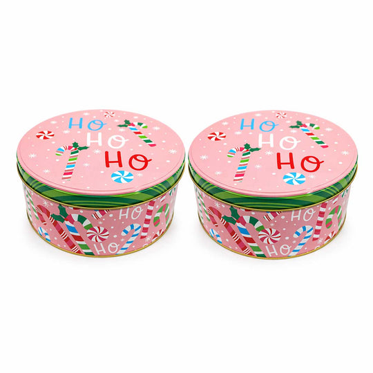 Two pink Christmas tins with candy cane design and 'HO HO HO' text on a white background.