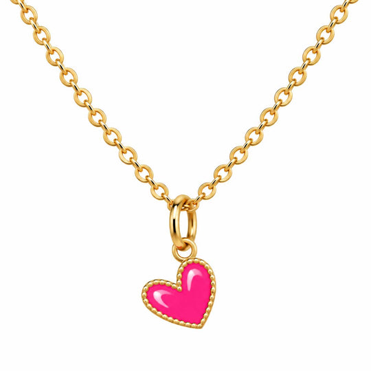 A gold chain necklace featuring a small heart-shaped pendant with a bright pink enamel center and a gold beaded border, shown against a plain white background.
