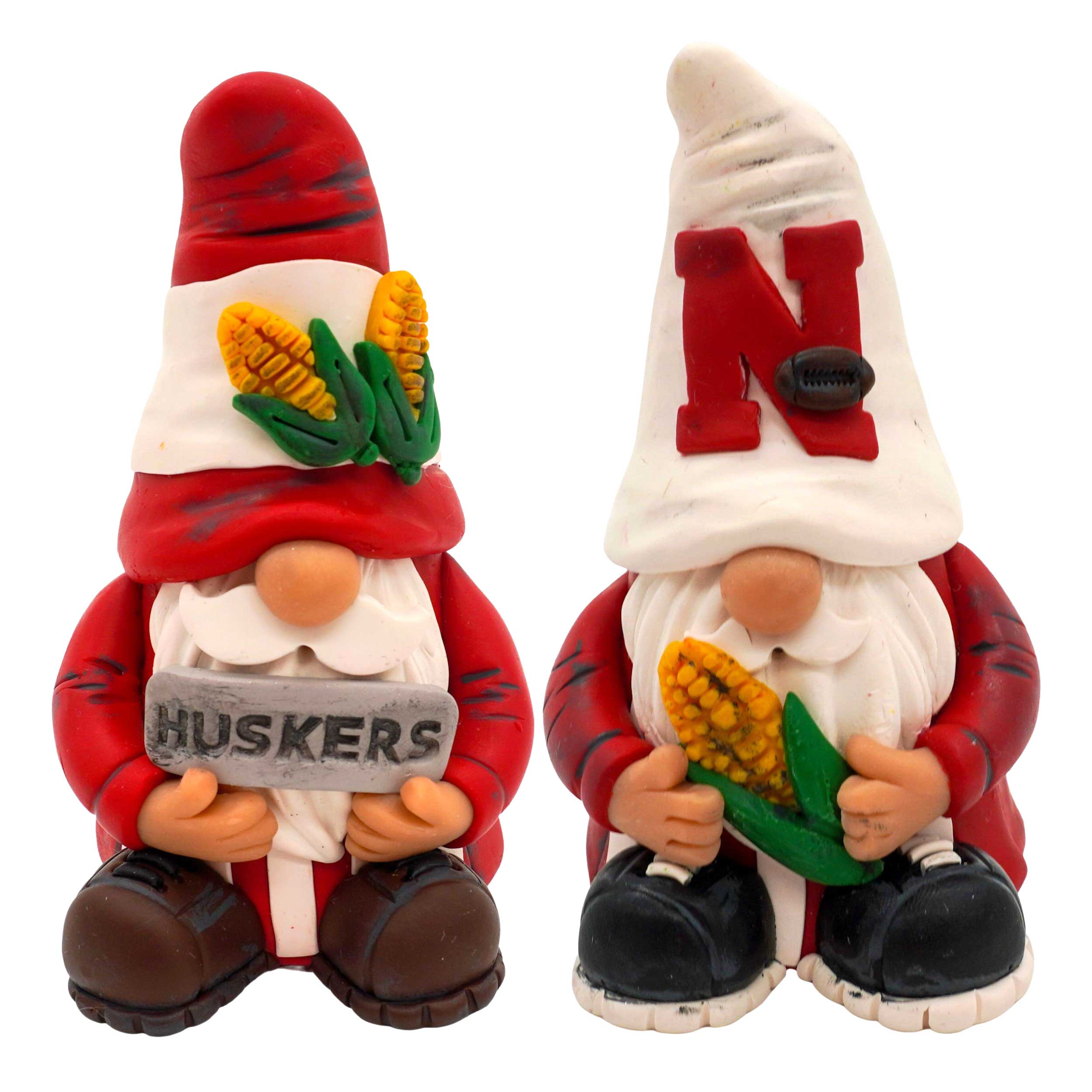 Two Husker gnomes in red outfits with corn and 'N' symbols on a white background