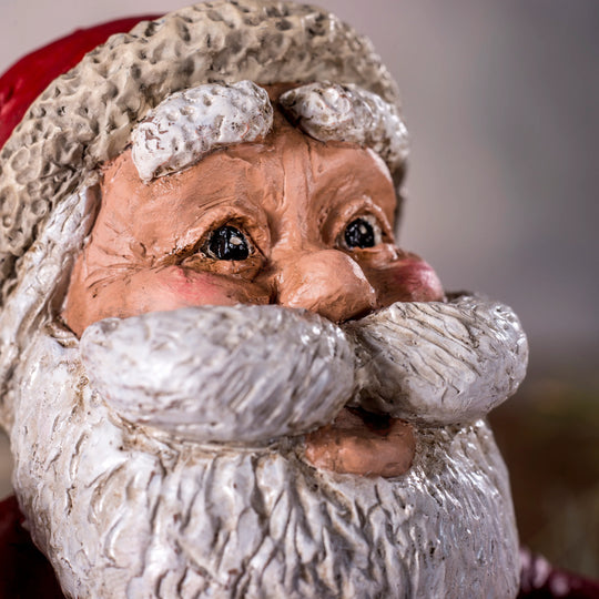 Close-up of a textured Santa Claus figurine with a blurred background