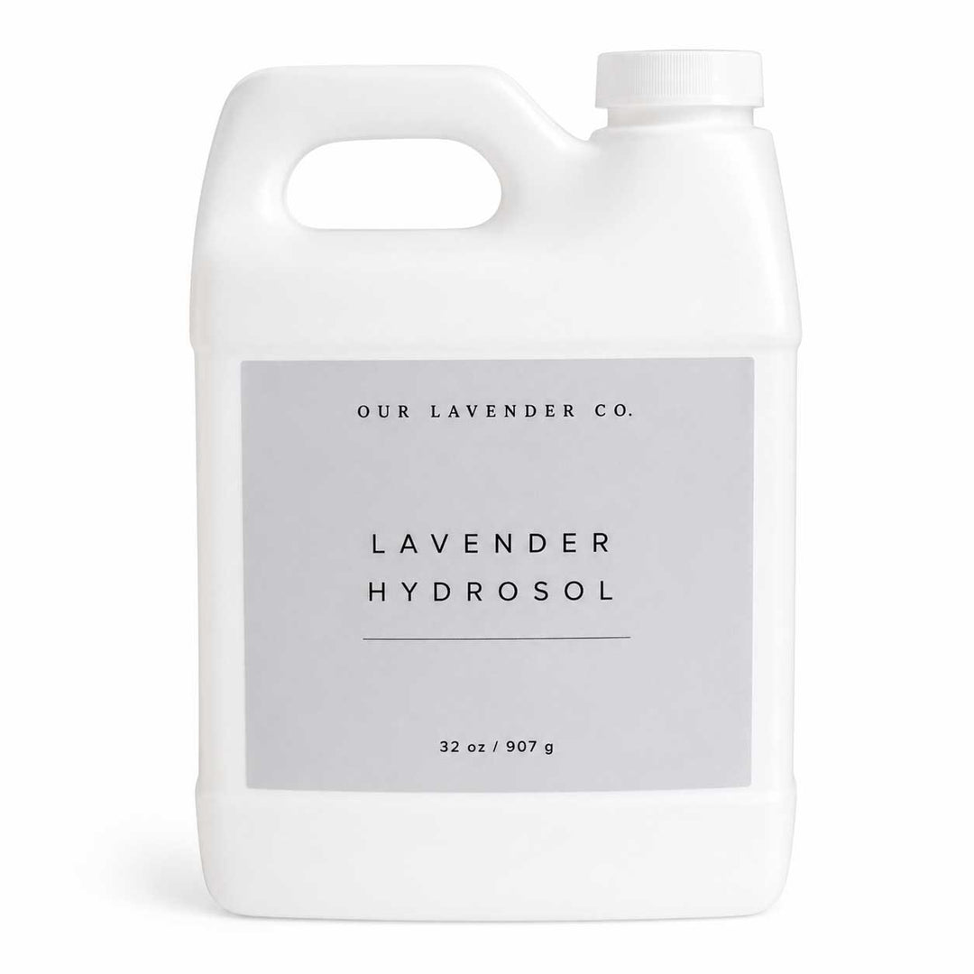 White bottle of lavender hydrosol with a gray label on a white background