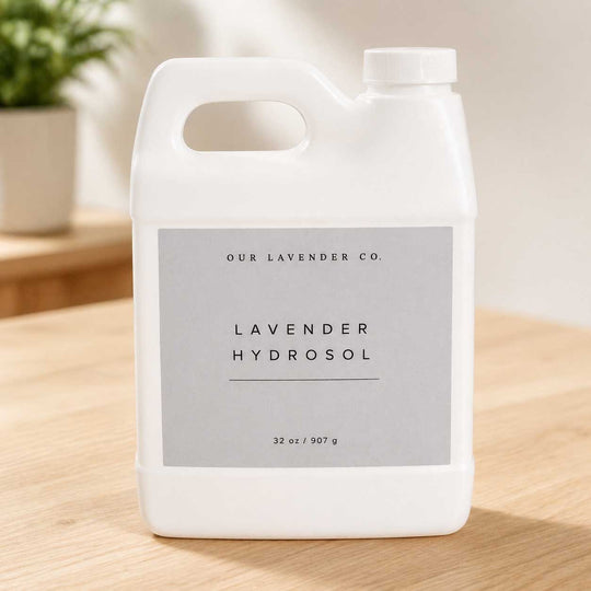 White bottle of lavender hydrosol with a label on a wooden surface