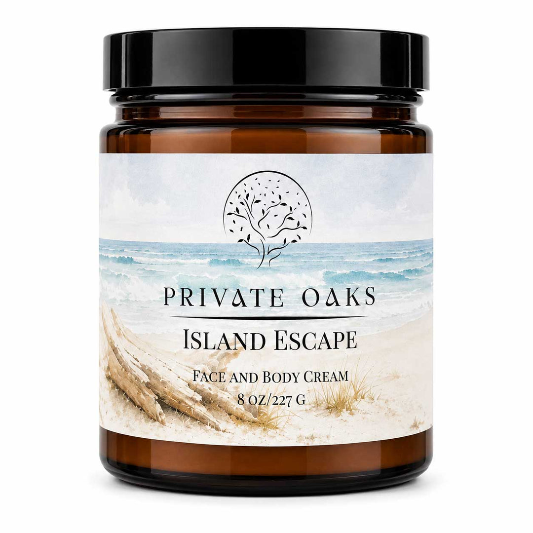An 8 oz amber glass jar of Private Oaks Island Escape Face and Body Cream with a black lid and a beach-themed label, set against a plain white background.