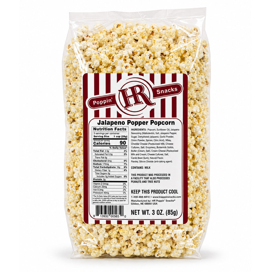 A 3 oz clear plastic bag of Poppin' Snacks Jalapeño Popper Popcorn, showing the detailed nutrition label on the front against a white background.