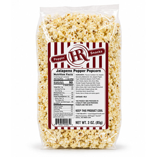 A 3 oz clear plastic bag of Poppin' Snacks Jalapeño Popper Popcorn, showing the detailed nutrition label on the front against a white background.
