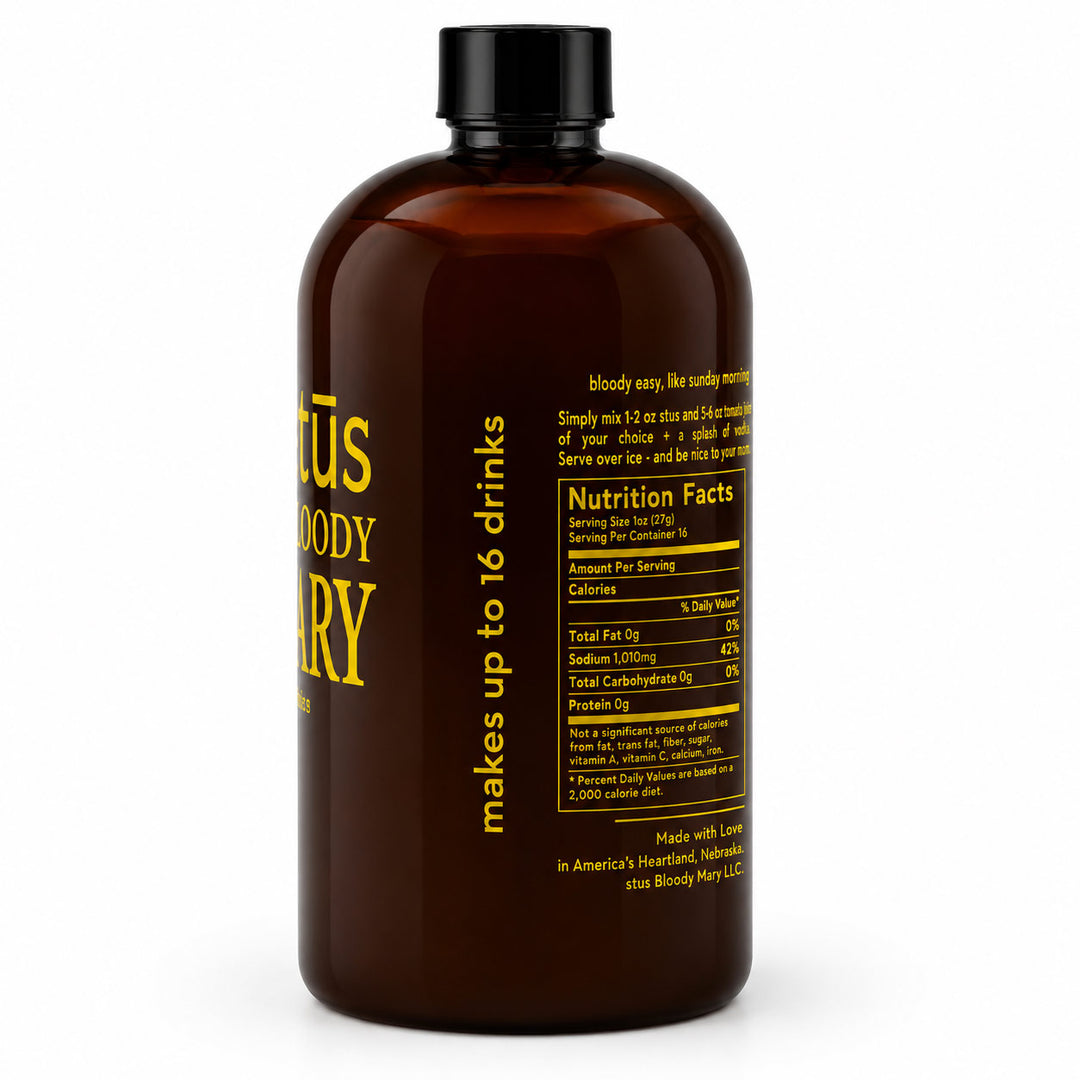 An amber brown bottle with a black cap, shown from the back with yellow text and a nutrition facts label. The label reads 'Bloody Mary' and 'makes up to 16 drinks'.