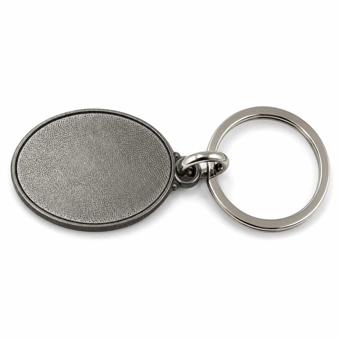 An oval metal keychain with a textured, antiqued silver-gray face and a polished silver key ring, shown on a clean white background.