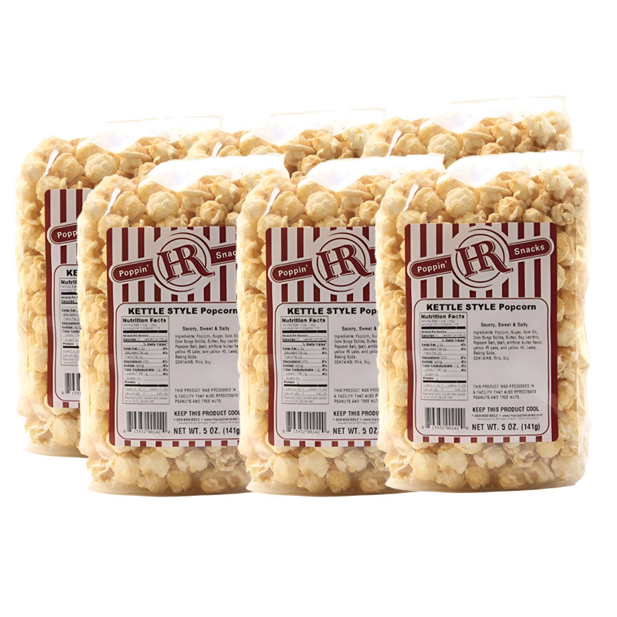 Six  packages of HR Poppin' Snacks Kettle Style Popcorn on a white background