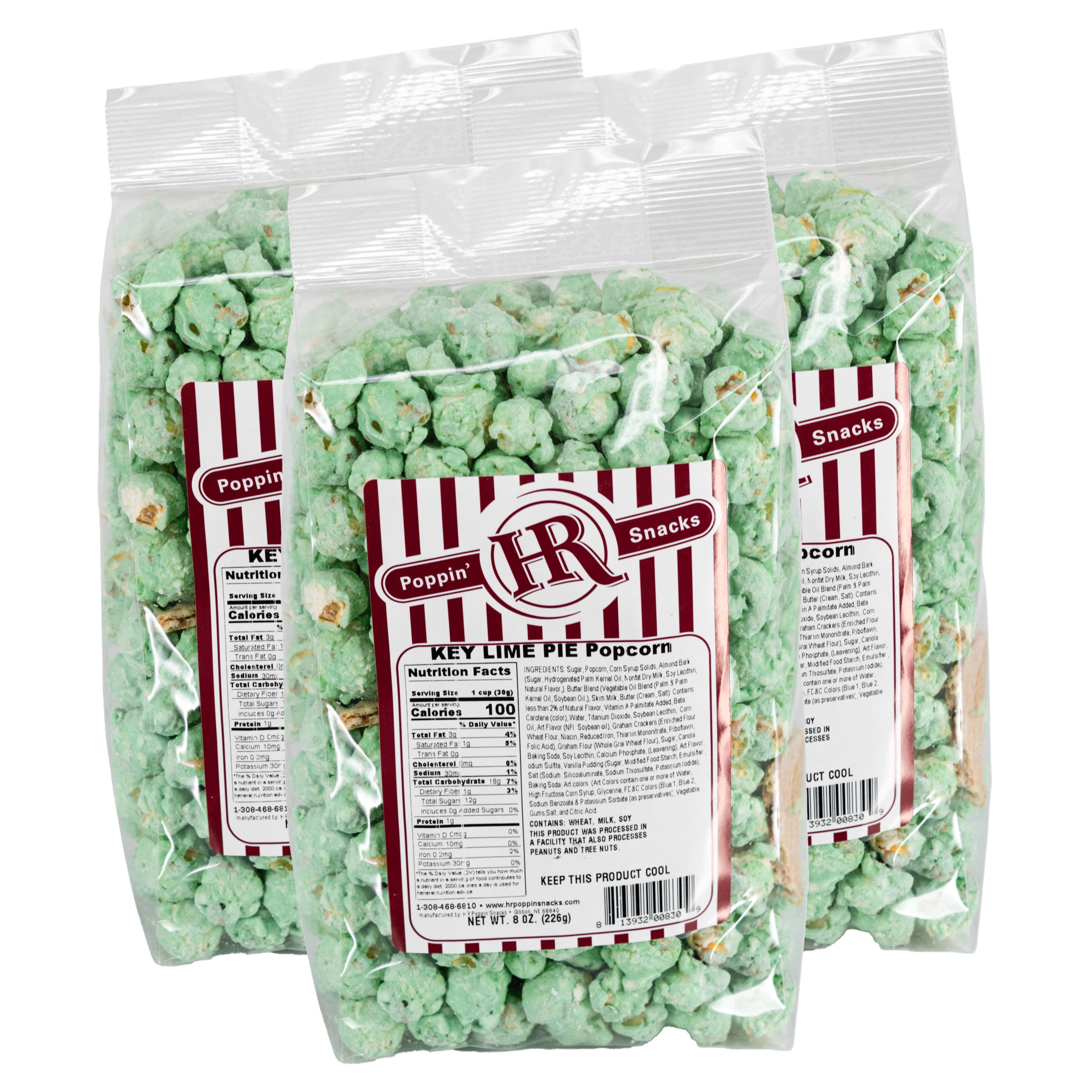 Three bags of key lime pie popcorn with a visible label on a white background