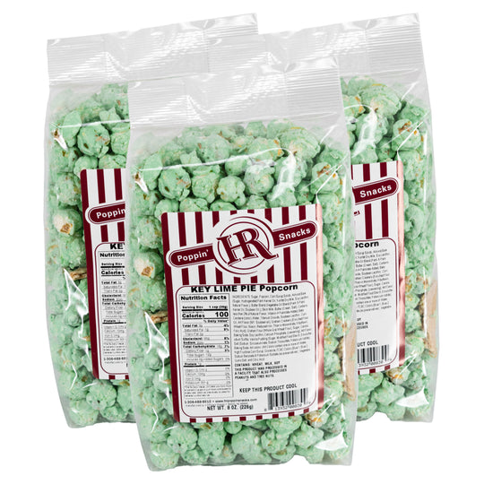 Three bags of key lime pie popcorn with a visible label on a white background