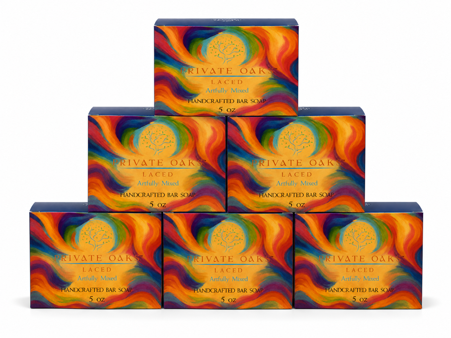 Six boxes of Private Oak Laced Handcrafted Bar Soap arranged in a pyramid stack on a white background. The packaging features a vibrant, multicolored abstract swirl pattern in orange, yellow, red, blue, and green with a gold circular tree logo and gold text.