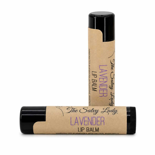 Two lavender lip balm sticks with black caps on a white background