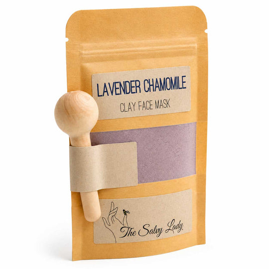 Clay face mask package with wooden applicator and 'The Salvy Lady' branding on a white background