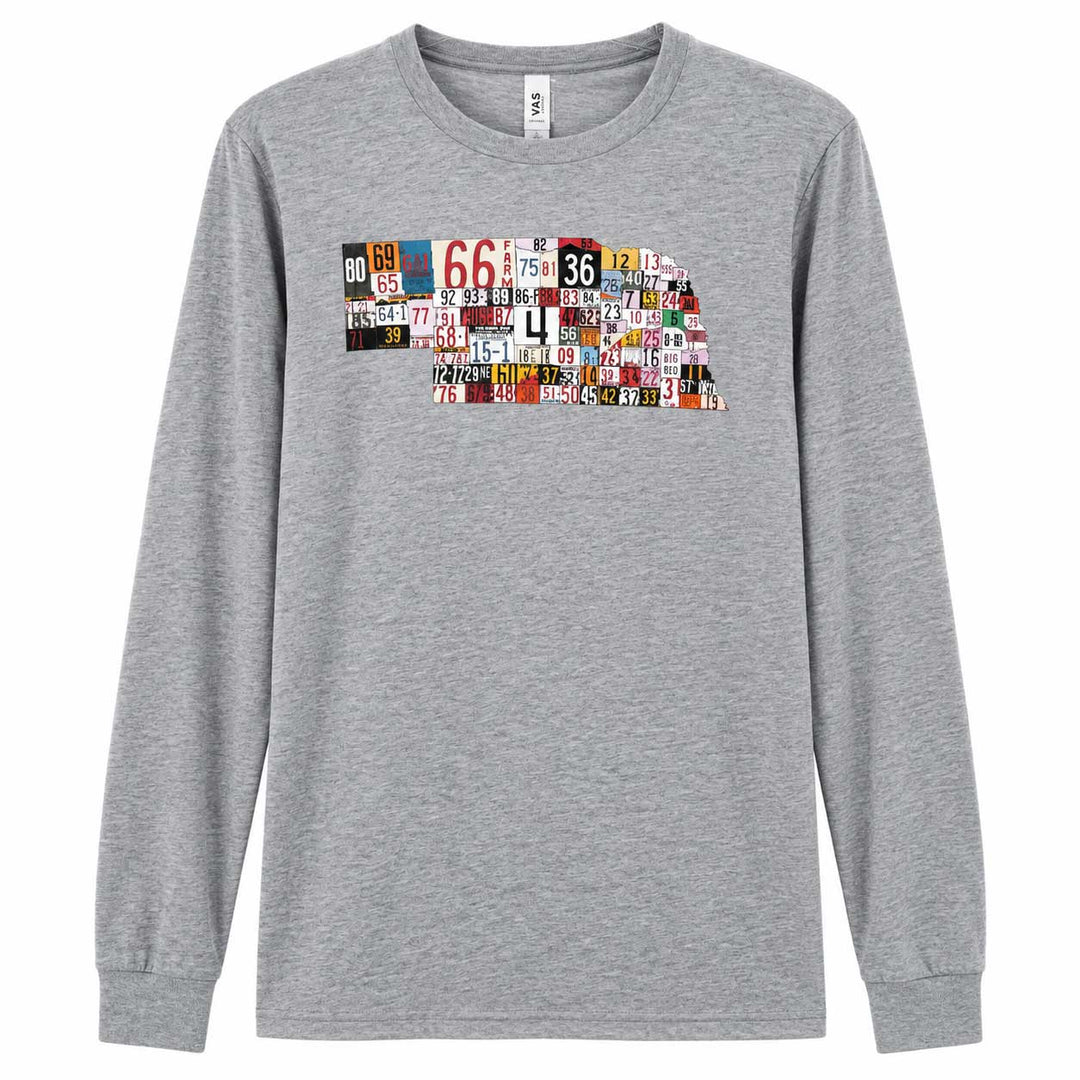 A heather gray long-sleeve crewneck t-shirt featuring a graphic of the state outline of Nebraska filled with a collage of vintage license plates, shown against a plain white background.