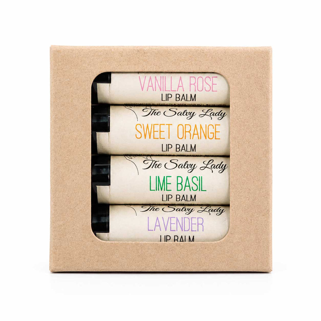 Set of lip balms in a cardboard box with visible labels.