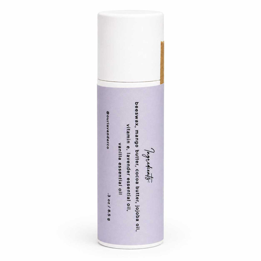 Skincare product with purple container and white cap on a white background