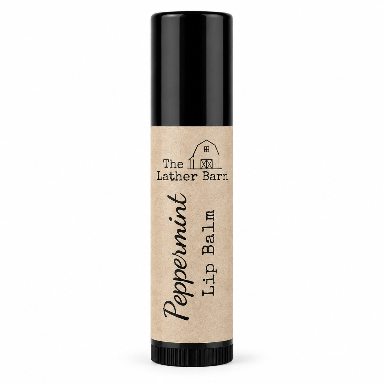 A single tube of Peppermint Lip Balm by The Lather Barn, featuring a natural kraft paper label and a black cap, set against a plain white background.