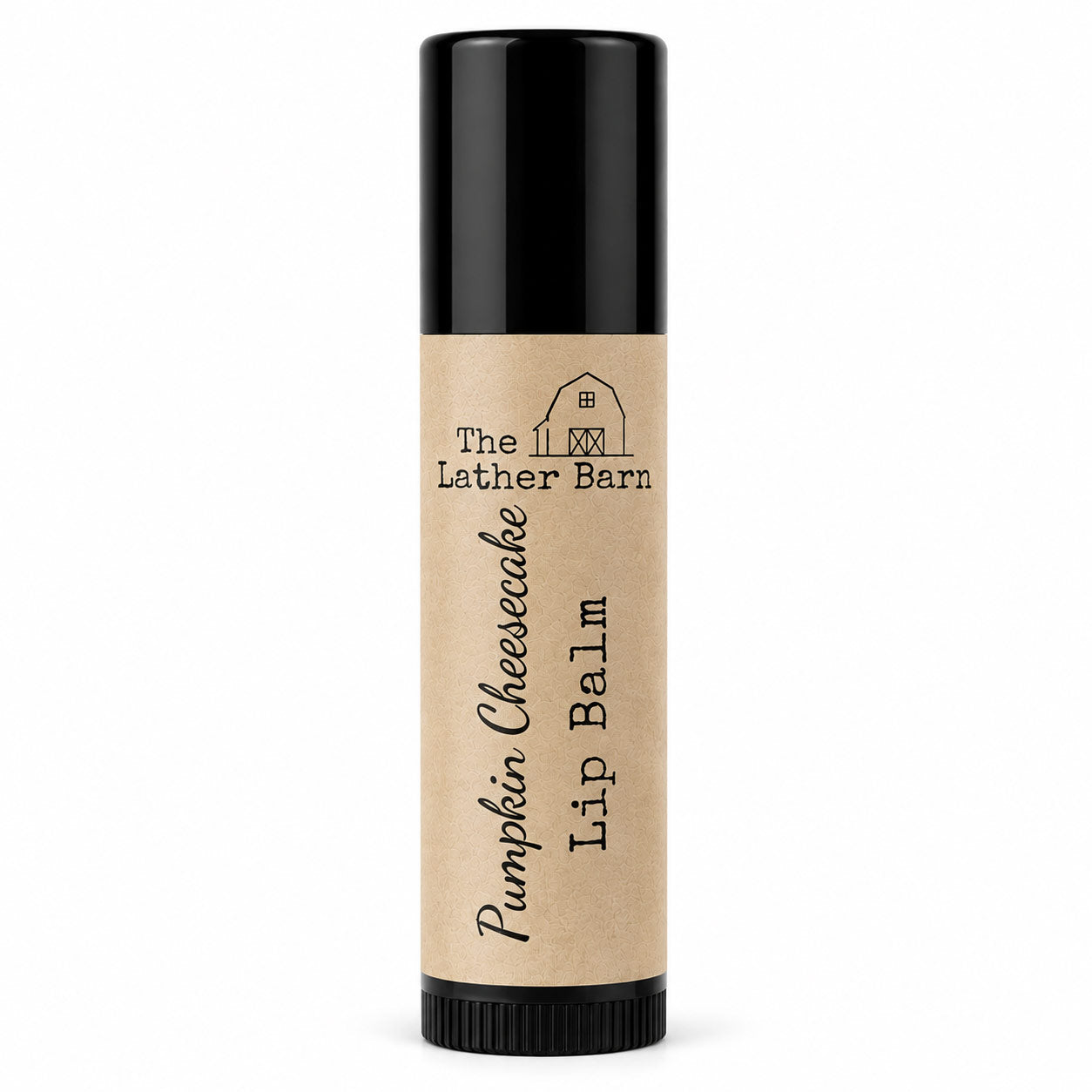 A single tube of lip balm with a kraft paper label reading 'The Lether Barn Pumpkin Cheesecake Lip Balm' on a plain white background.