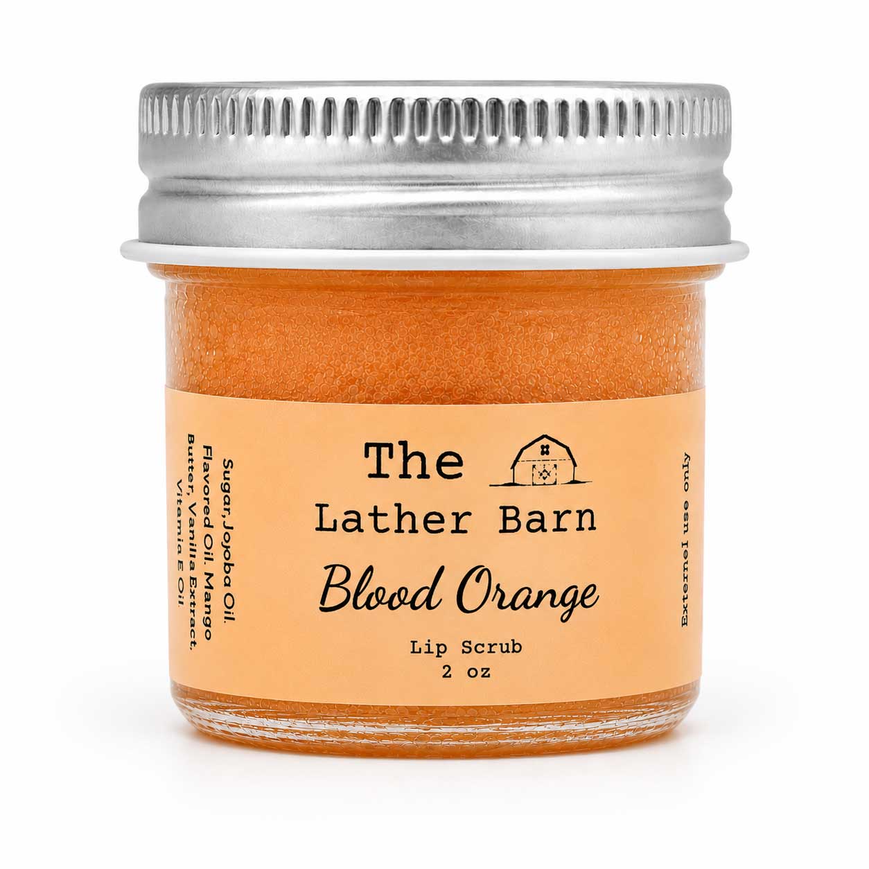 A 2 oz glass jar of 'The Lather Barn' Blood Orange Lip Scrub, filled with a vibrant orange scrub and topped with a silver metal screw lid, set against a plain white background.