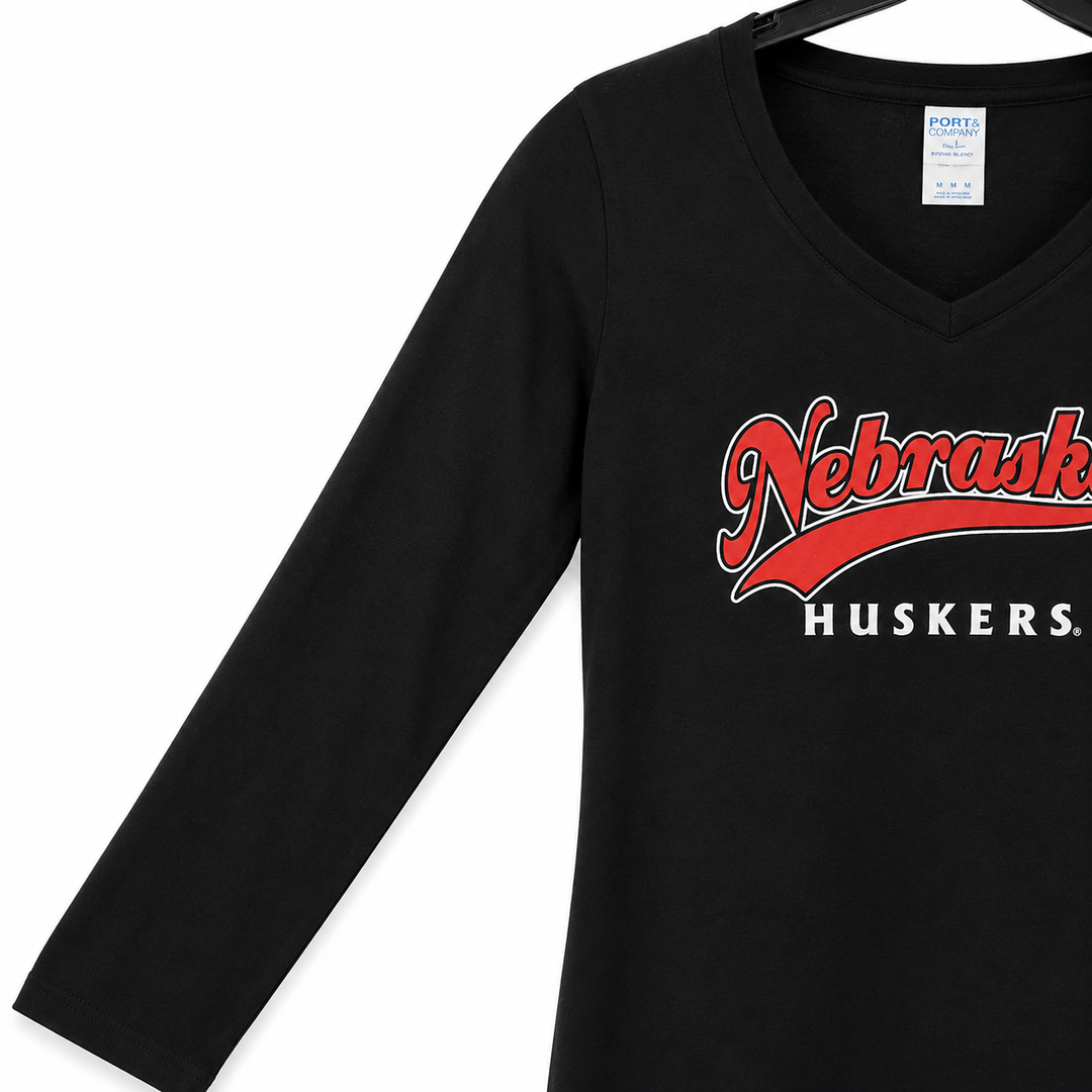 Black long-sleeve shirt with 'Nebraska Huskers' text on a white background