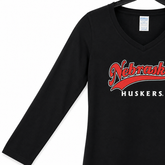 Black long-sleeve shirt with 'Nebraska Huskers' text on a white background