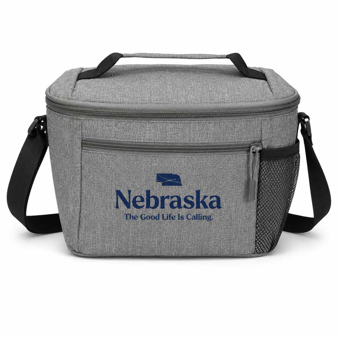 A gray heathered insulated lunch bag with black handles and shoulder strap, featuring a blue Nebraska logo and 'The Good Life Is Calling' text on the front pocket.