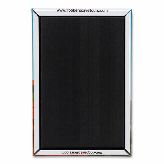 A rectangular black textured panel with a silver metallic frame, featuring website text at the top and bottom, shown against a plain white background.
