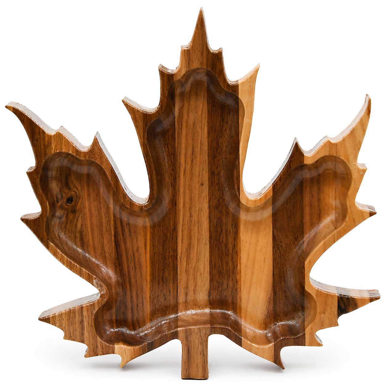 Wooden tray shaped like a maple leaf on a white background