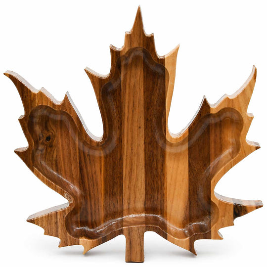 Wooden tray shaped like a maple leaf on a white background